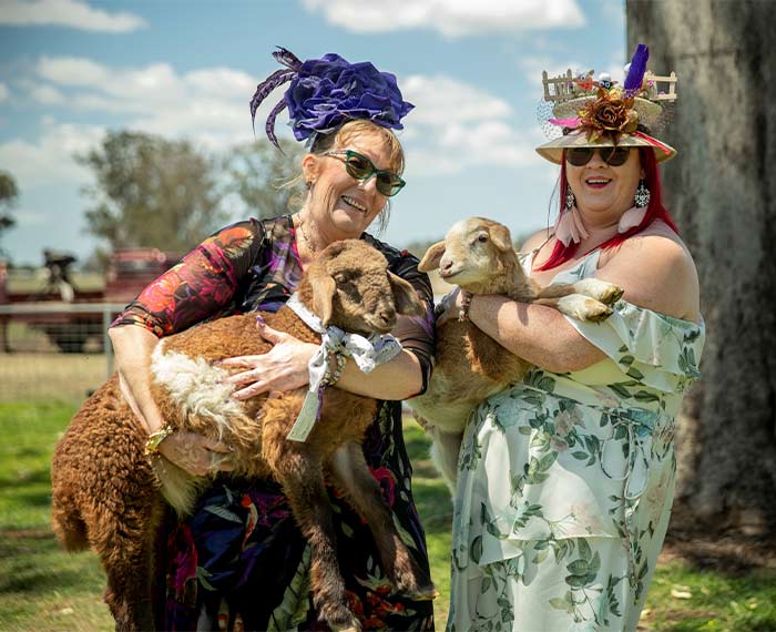 Image of ladies with sheep at race event